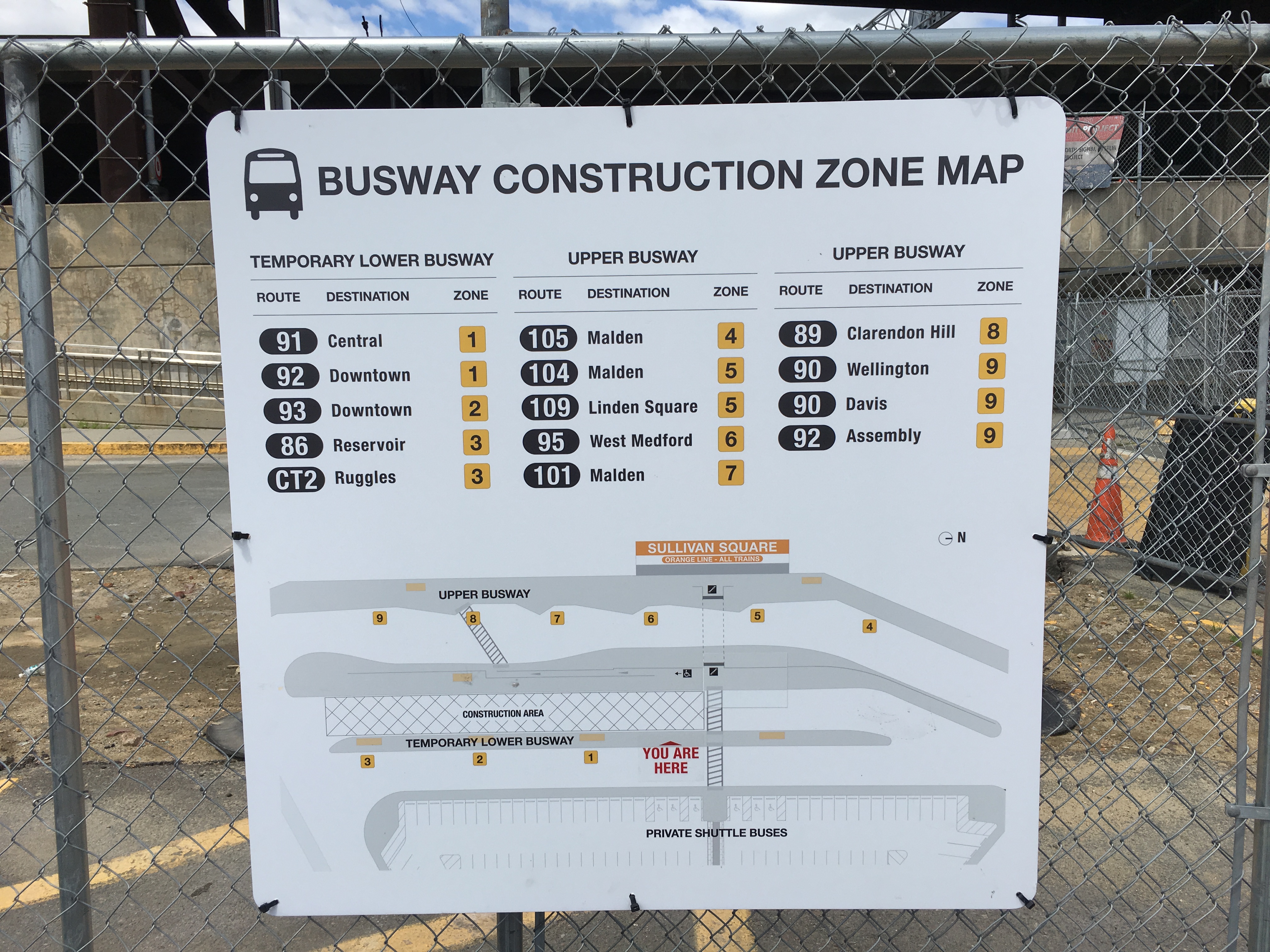 Photo of a map posted on a chain link fence of the temporary lower busway at Sullivan